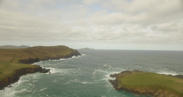 Transparent Scenic Ocean View with Cloudy Sky and Rugged Cliffs - Download Free Stock Videos Pikwizard.com