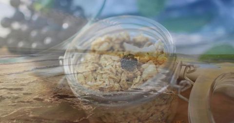 Granola jar overlapping ocean waves double exposure for healthy eating, wellness and coastal travel