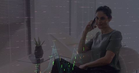 Businesswoman Analyzing Data While on Phone Call