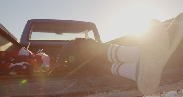 Relaxing in Pickup Truck Bed with Sunflare View - Download Free Stock Images Pikwizard.com