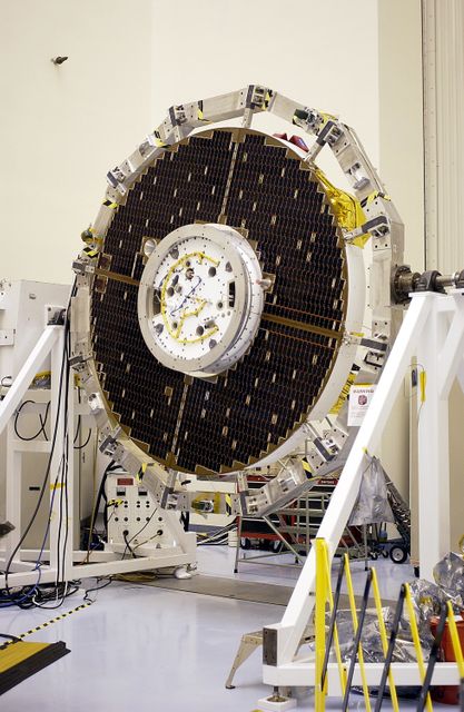 This image shows the solar panels on the cruise stage of a Mars Exploration Rover during testing at the Kennedy Space Center. It highlights the engineering and technology involved in preparing the rovers for their mission to Mars. Once testing and mission simulations are complete, the spacecraft elements will be integrated for flight. Two identical rovers are scheduled for separate launch windows, tasked with searching for evidence of past liquid water on Mars. This image can be used for educational purposes, space exploration promos, technology showcases, and documentaries.