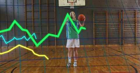 Female basketball player preparing jump shot with analytics overlay in indoor court