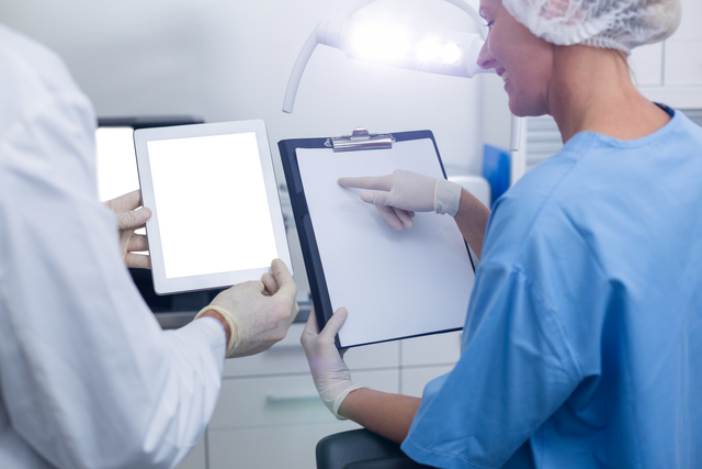 Dental Professionals Collaborating with Tablet in Modern Clinic - Download Free Stock Videos Pikwizard.com