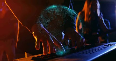 Keyboardist Hands Playing Synth Creating Teal Holographic Particle Globe on Stage