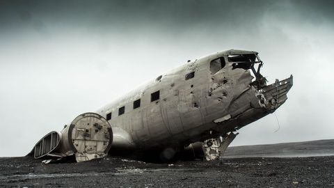 Abandoned ww2 airplane wreck on black sands of solheimasandur
