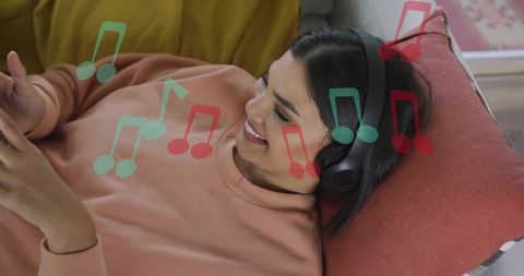 Woman Relaxing with Headphones Enjoys Music at Home