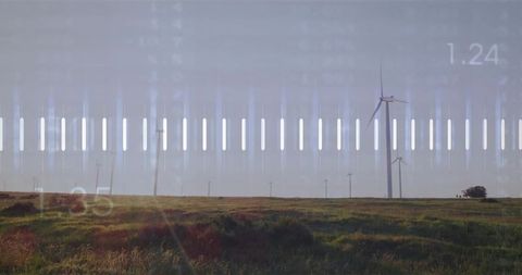 Rotating Wind Turbine Over Grassland with HUD Overlay and Lens Flare, Renewable Energy