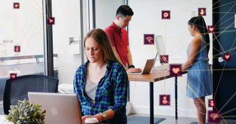 Diverse Colleagues Engaged in Modern Digital Office Environment