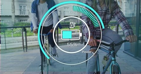 Friendly ride: young men on e-bikes with eco-power display