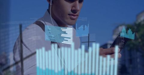 Hispanic man analyzing mobile data with digital bar charts outdoors