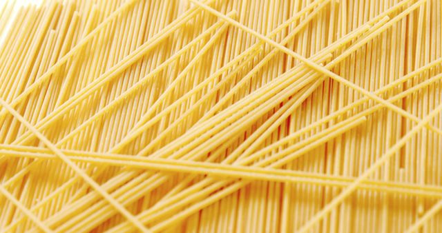 Close-up of raw spaghetti on white background