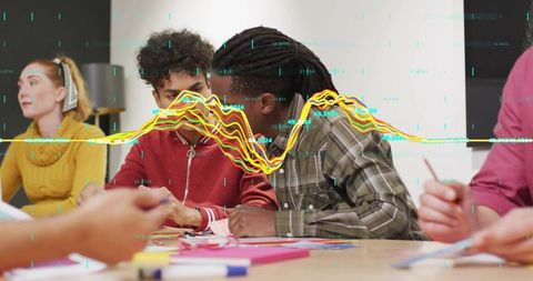 Collaborating team analyzing data visualizations and brainstorming with sticky notes in workspace