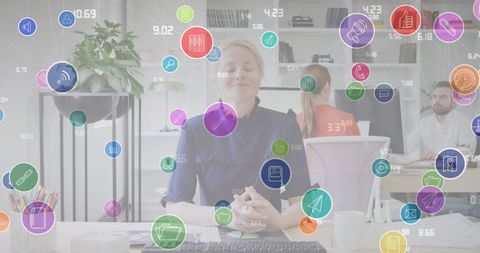 Businesswoman engaging in virtual meeting with data icons overlay
