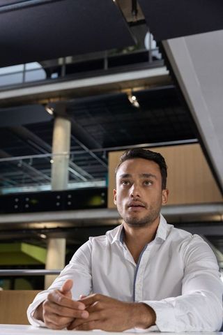 Businessman in modern office environment fostering professional collaboration