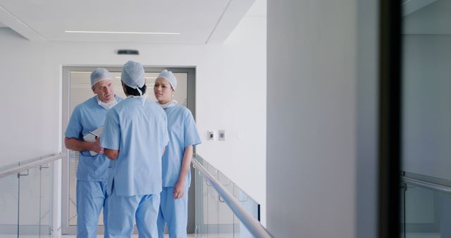 Doctors in Hospital Hallway Discussing Patient Records - Download Free Stock Images Pikwizard.com