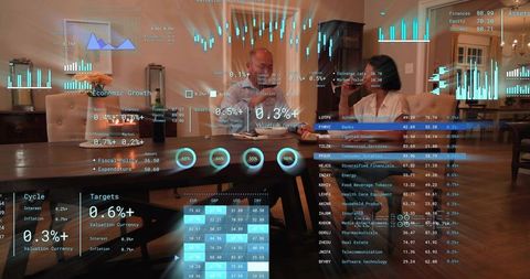 Senior couple reviewing finances with augmented reality overlays at dining table