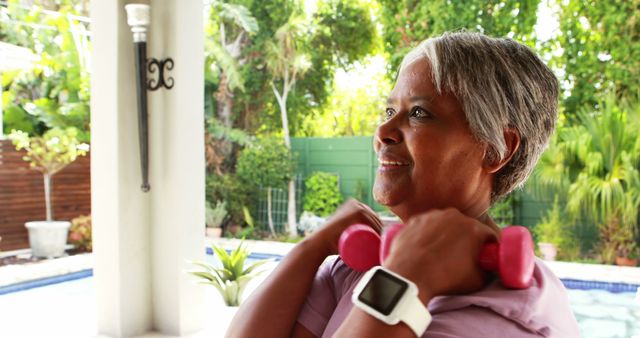 Senior Woman Exercising with Dumbbells by Poolside - Download Free Stock Images Pikwizard.com