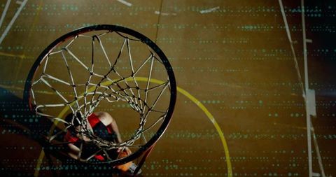 Top-down player driving and dunking through braided net with teal data overlay