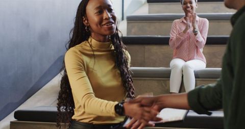 Successful Businesswoman Celebrating Achievement on Office Staircase