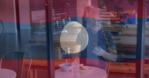 Senior Man Enjoying Lunch in Modern Coffee Shop Environment