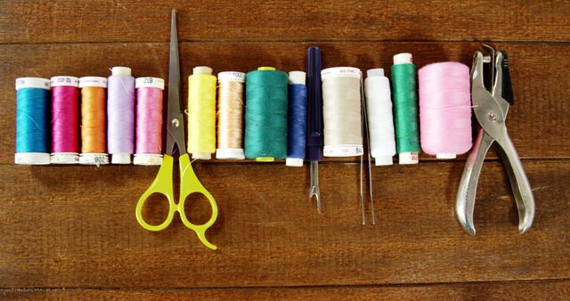 Assorted Colorful Sewing Threads and Tools on Rustic Wooden Table - Download Free Stock Images Pikwizard.com