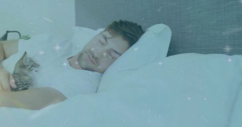 Man Sleeping Peacefully in Bed with Cat.