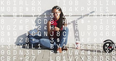 City life: young woman relaxing with smartphone on street