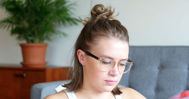 Young Woman with Glasses Relaxing at Home - Download Free Stock Images Pikwizard.com