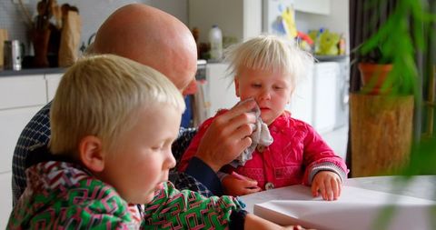 Father Caring for Children at Home