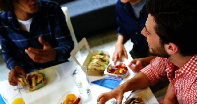 Group of Friends Enjoying Casual Indoor Meal Together - Download Free Stock Images Pikwizard.com