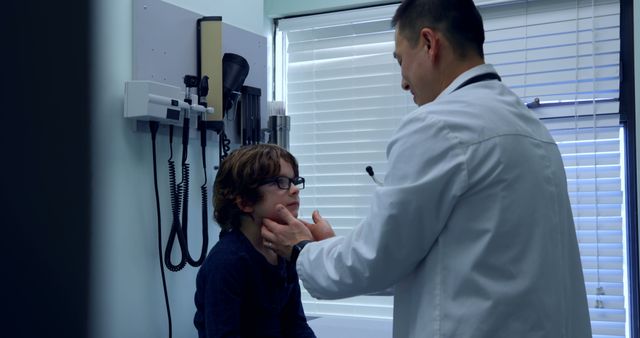 Doctor Examining Young Patient in Medical Clinic - Download Free Stock Images Pikwizard.com