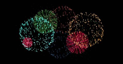 Vibrant Fireworks Display Explodes in Darkness