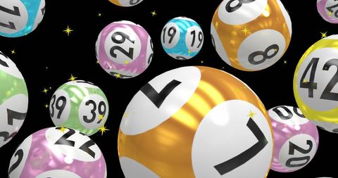 Floating numbered balls with golden stars on black background