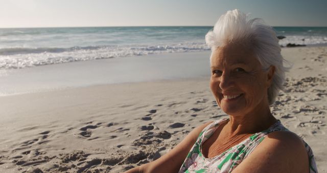 Senior Woman Relaxing at Beach with Bright Smile - Download Free Stock Images Pikwizard.com