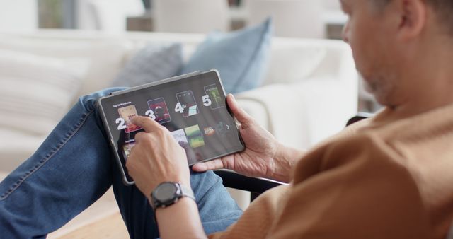 Man Using Tablet with Digital Buttons Relaxing at Home - Download Free Stock Images Pikwizard.com