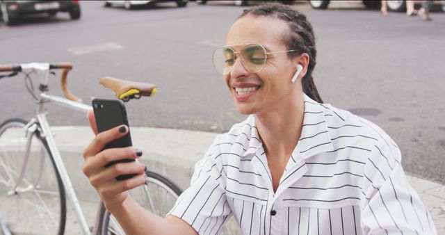 Young Man with Dreadlocks Video Calling on Smartphone Outdoors - Download Free Stock Images Pikwizard.com