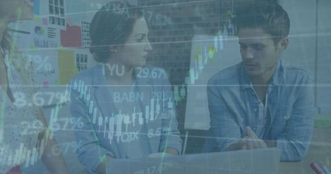 Business Team Analyzing Stock Market Trends in Office Meeting