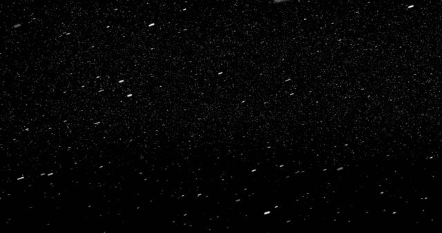 Particles of snow falling from sky at night 4k
