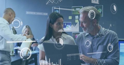 Business Team Analyzing Digital Data with Technology in Modern Office