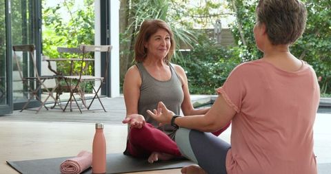 Happy Friends Meditating Together in Calm Indoor Space