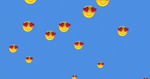 Heart eyes emojis floating on blue background