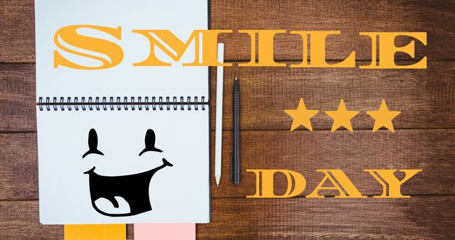 Digital composite image of smile day text with stars over table with pens and smiley icon on notepad. Mood and feeling, emotion, happiness, emoticon, special occasion.