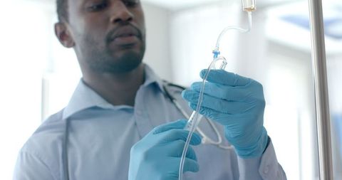 Healthcare Professional Administering IV in Hospital Setting