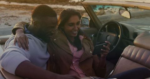 happy diverse couple on road trip in convertible - Download Free Stock Images Pikwizard.com
