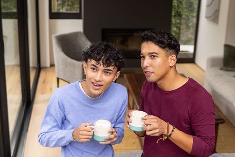 Diverse Friends Enjoying Coffee in Modern Living Room