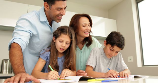 Happy Family Helping Children with Homework in Modern Kitchen - Download Free Stock Images Pikwizard.com