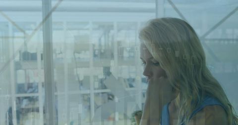 Caucasian Businesswoman Analyzing Digital Data in Office Environment