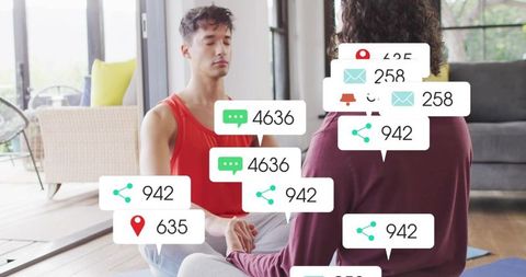 Couple meditating holding hands in sunlit living room with digital notification graphics