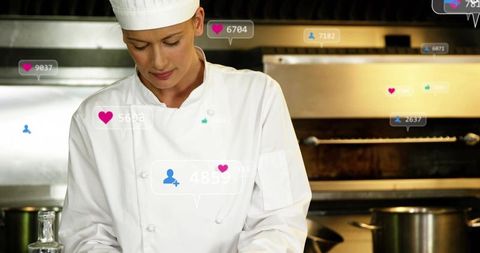 Female chef preparing dish in stainless commercial kitchen with floating social media icons