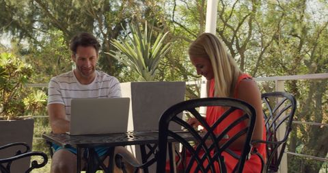 Couple Enjoying Relaxing Outdoors with Laptops in Sunny Resort Setting - Download Free Stock Images Pikwizard.com